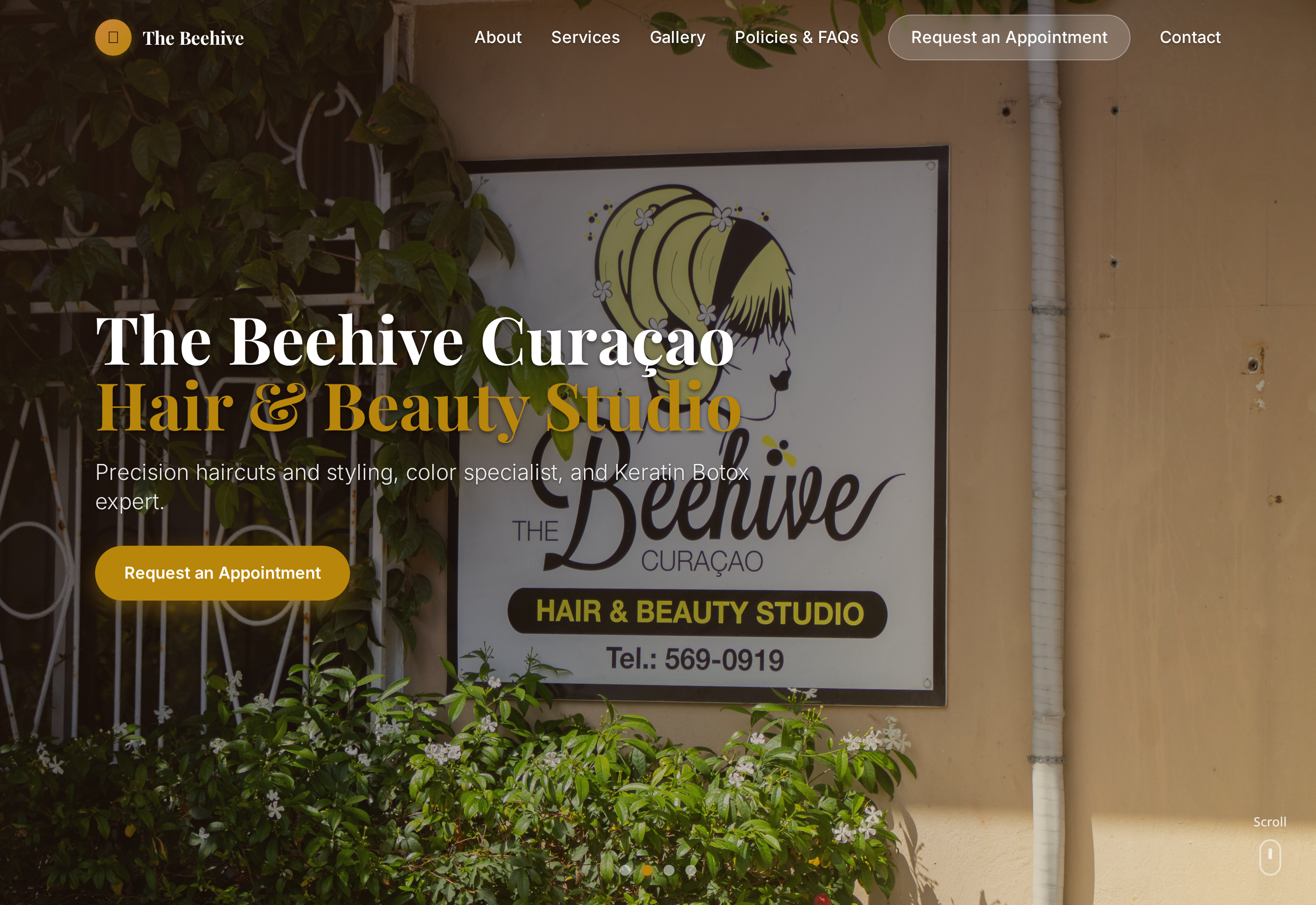 The Beehive Curaçao homepage with the studio sign photographed on the street and an appointment request call to action
